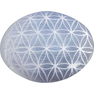 Selenite palm stone etched flower of life